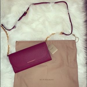Burgundy Burberry Leather wallet crossbody.